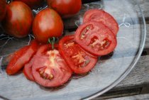 Salad Tomato Varieties—'Black Zebra' is a tart, purplish-black heirloom tomato with red stripes